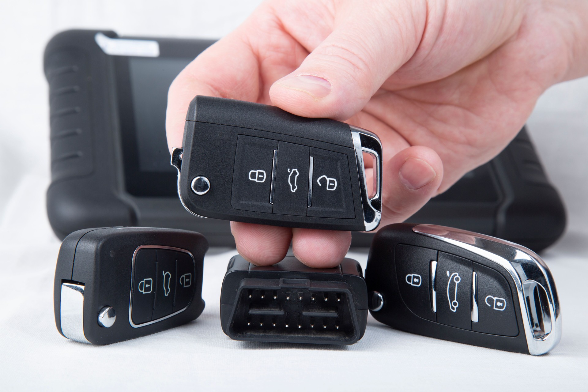 Production of car keys, Programming of car keys and repair.