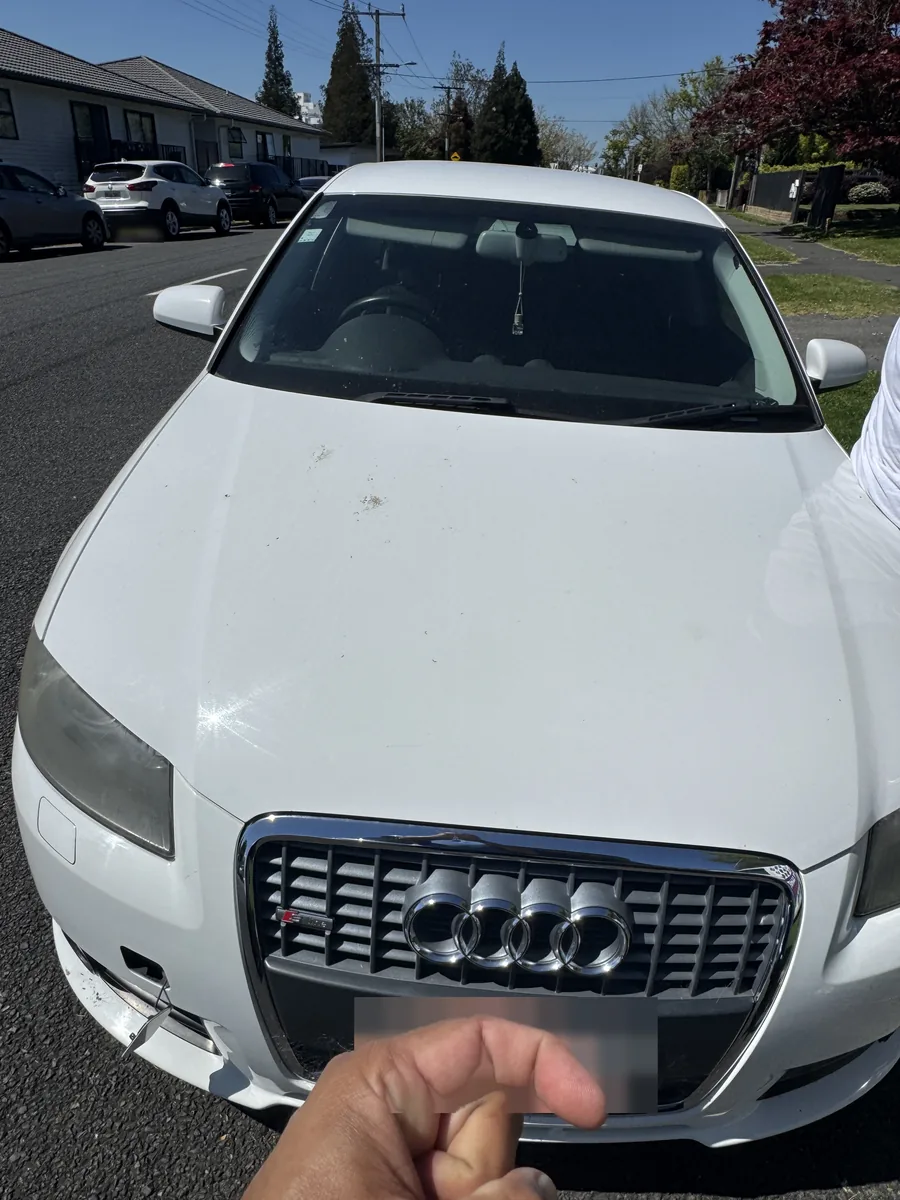 White Audi A3 seen from the front on a Hamilton street